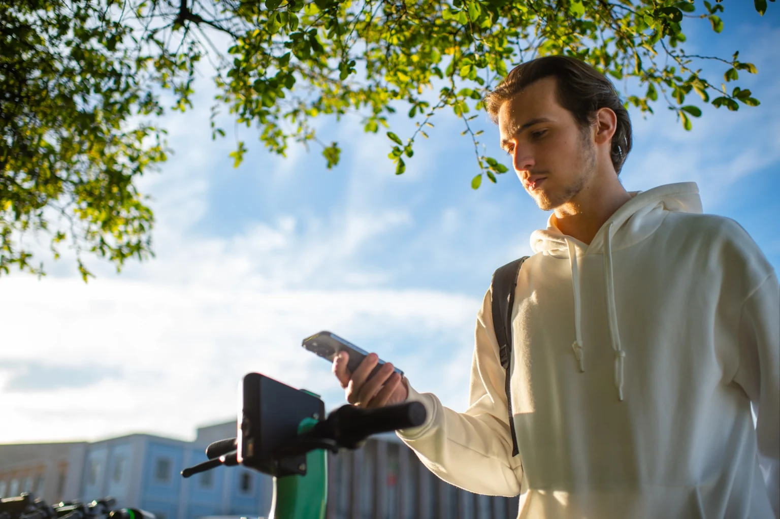 student-scanning-the-electric-scooter-s-qr-code-by-2023-11-27-05-32-34-utc copia